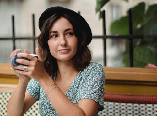 Free Woman in Blue and White Dress Holding a Cup Stock Photo