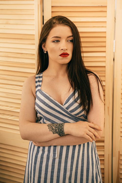 Woman in Blue and White Stripe Sleeveless Dress