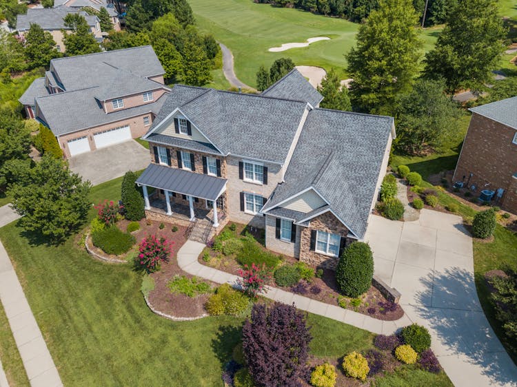 House With Green Grass Lawn