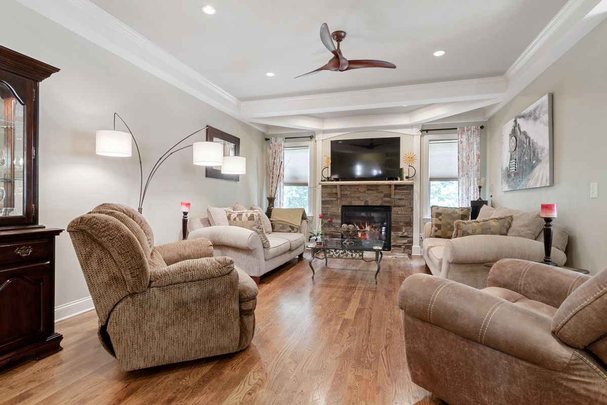 A spacious living room with clean, coordinated wall colors.