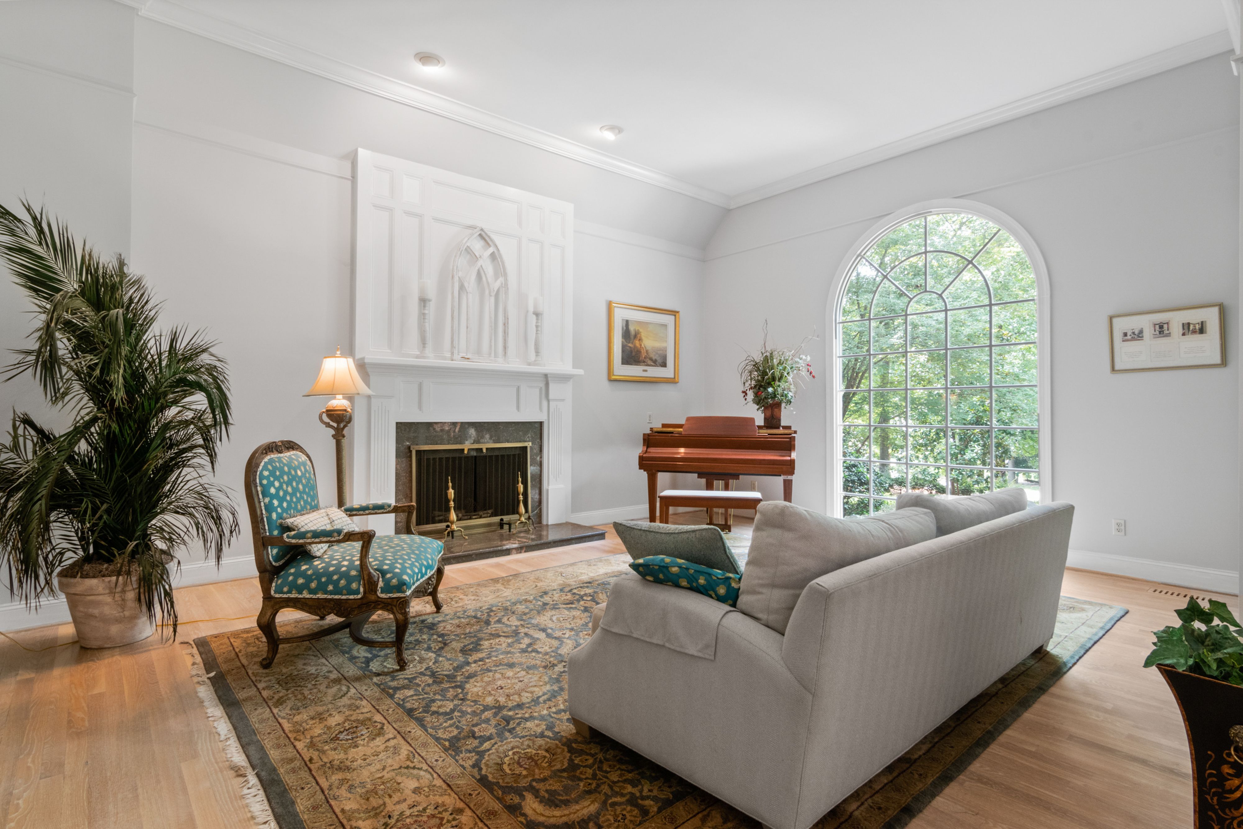 Gray Sofa Near Fireplace and Window