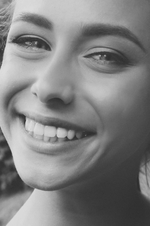 Free Close-up black and white portrait of a woman smiling outdoors in Kyiv, Ukraine. Stock Photo