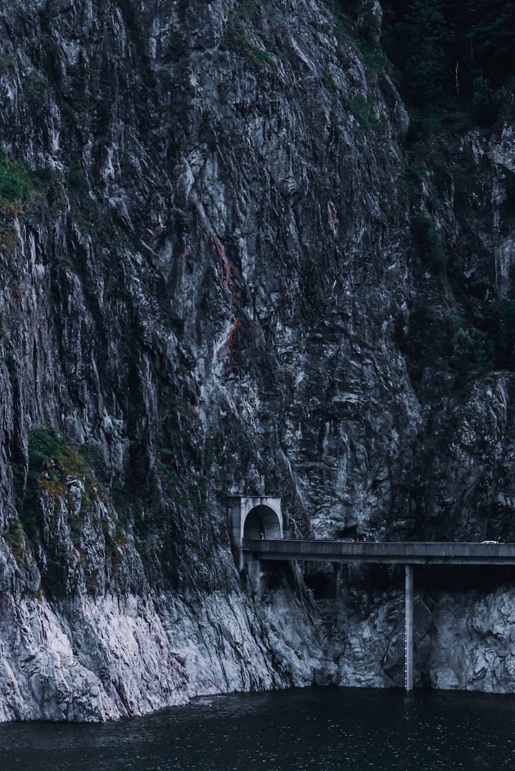 Highway Over River In Mountainous Tunnel