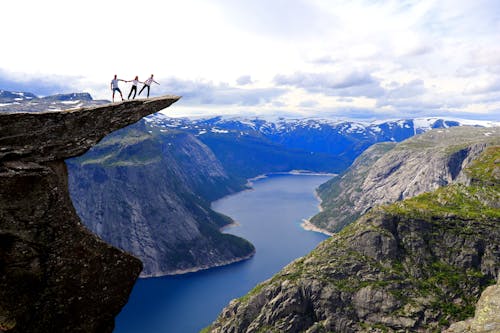 People Standing on a Cliff