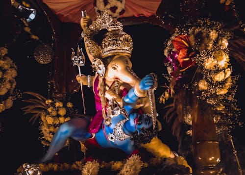 Hindu Deity Figurine Decorated with Flowers