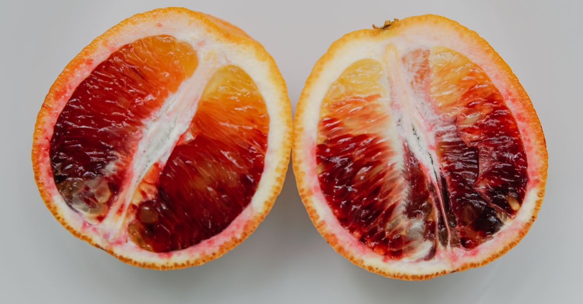 A fresh, juicy blood orange sliced in half showcasing its vibrant colors and textures. - Evidence evidence guide for citrus bioflavonoid blood pressure meta-analysis