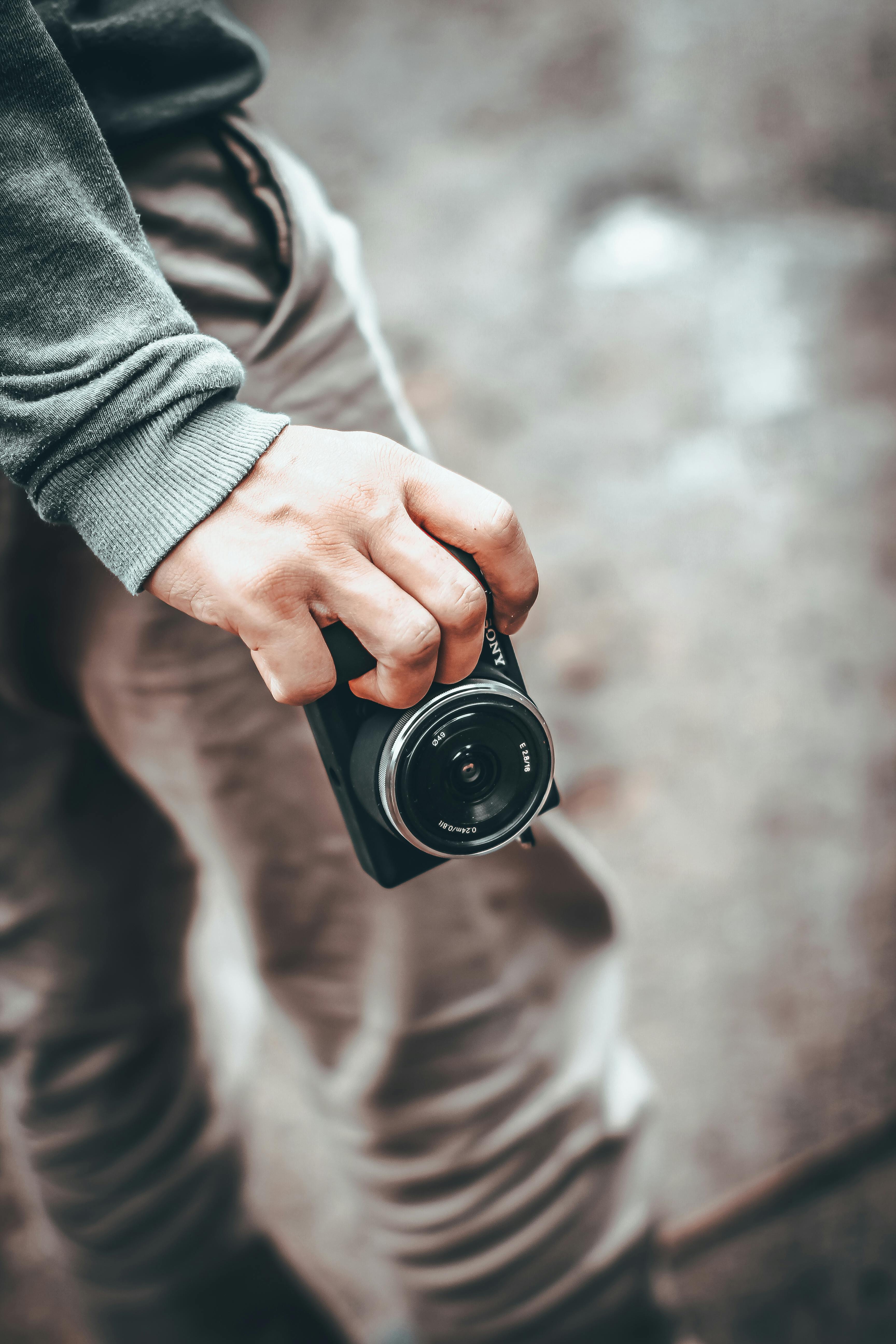 Person Holding a Camera · Free Stock Photo