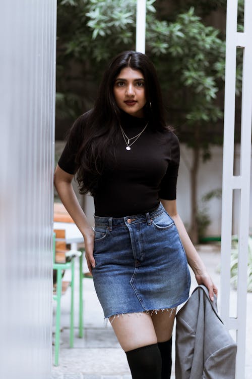 Woman in Black Turtle Neck T-shirt and Blue Denim Skirt · Free Stock Photo