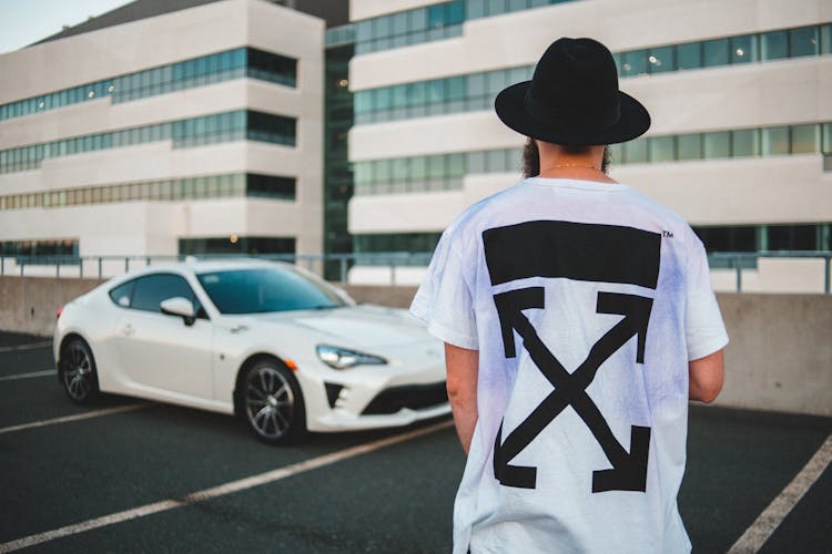 Bearded Man In Trendy T Shirt Near Luxury Sport Car