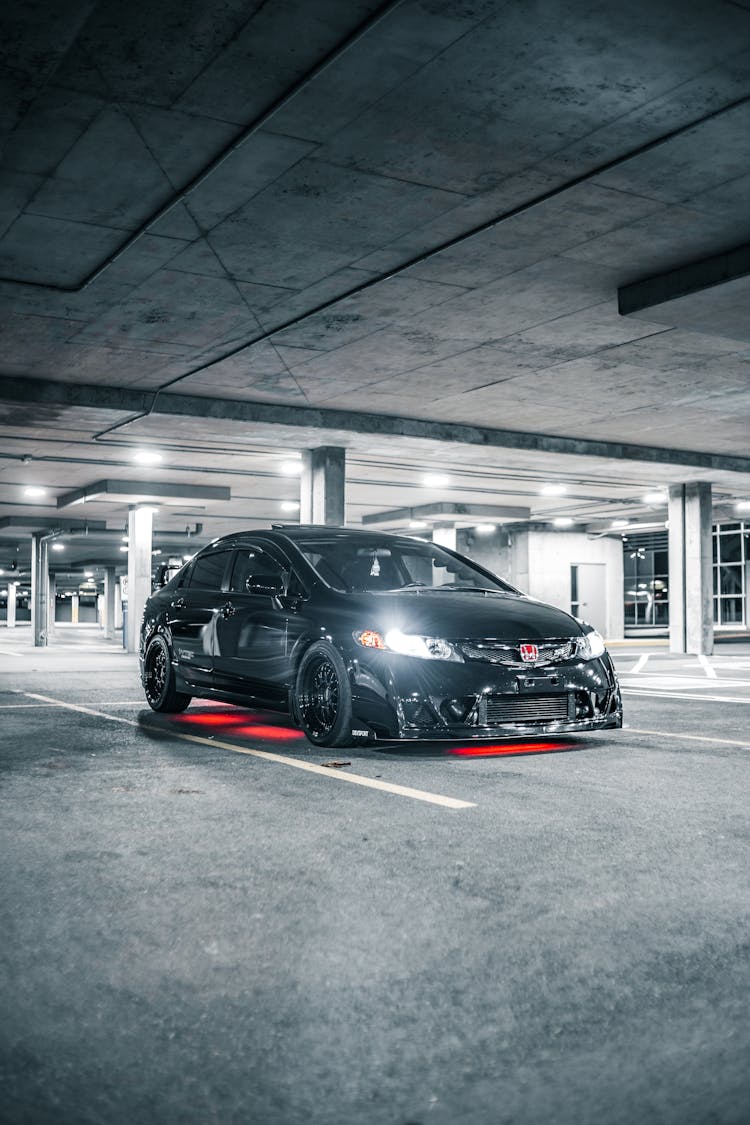 Contemporary Black Car On Parking Lot