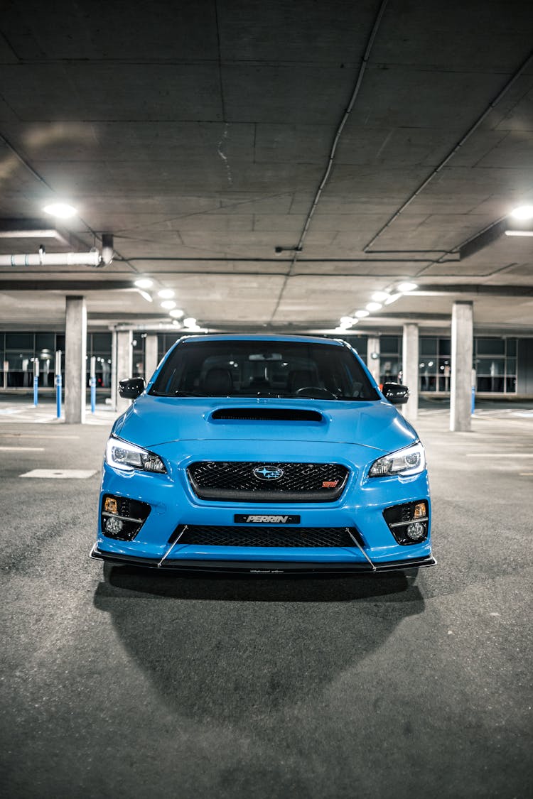 Modern Blue Car On Parking Lot