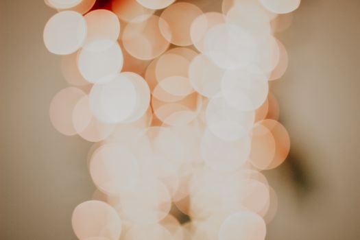 Blurred abstract bokeh pattern with warm, soft lights creates a serene and dreamy atmosphere.