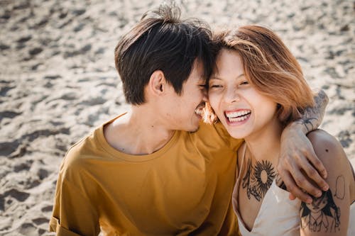 Photo of Man and Woman Smiling