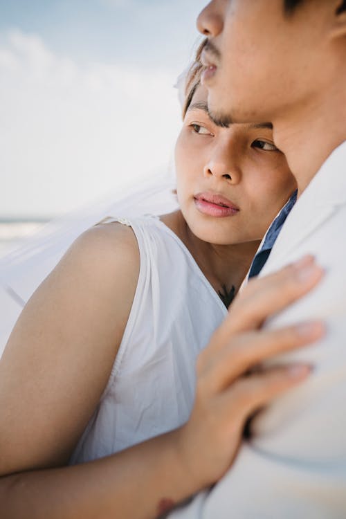 Free Woman Leaning on Man's Chest Stock Photo