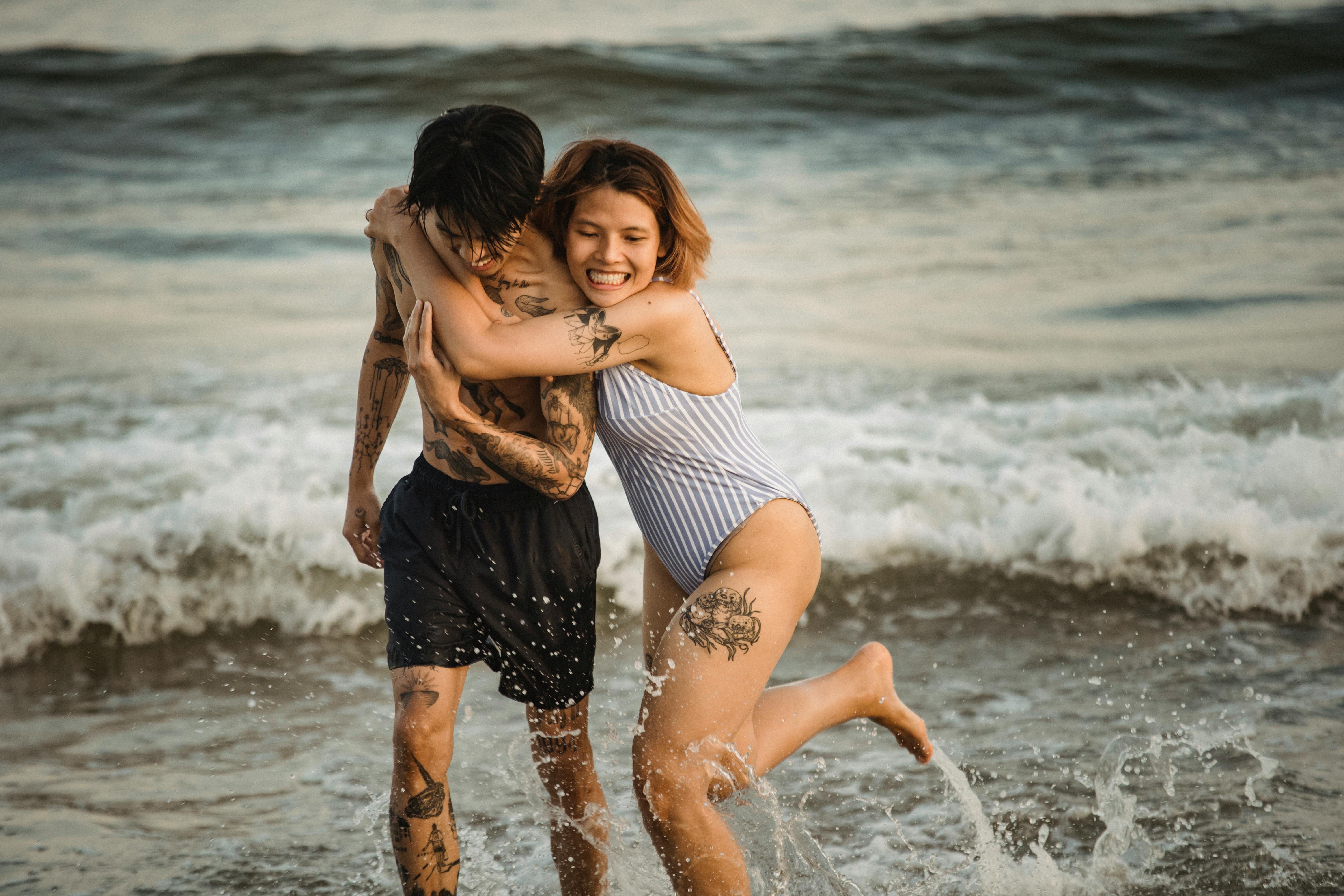 Man and Woman Enjoying the Beach · Free Stock Photo pic
