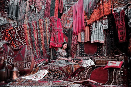 Woman Sitting on a Carpet