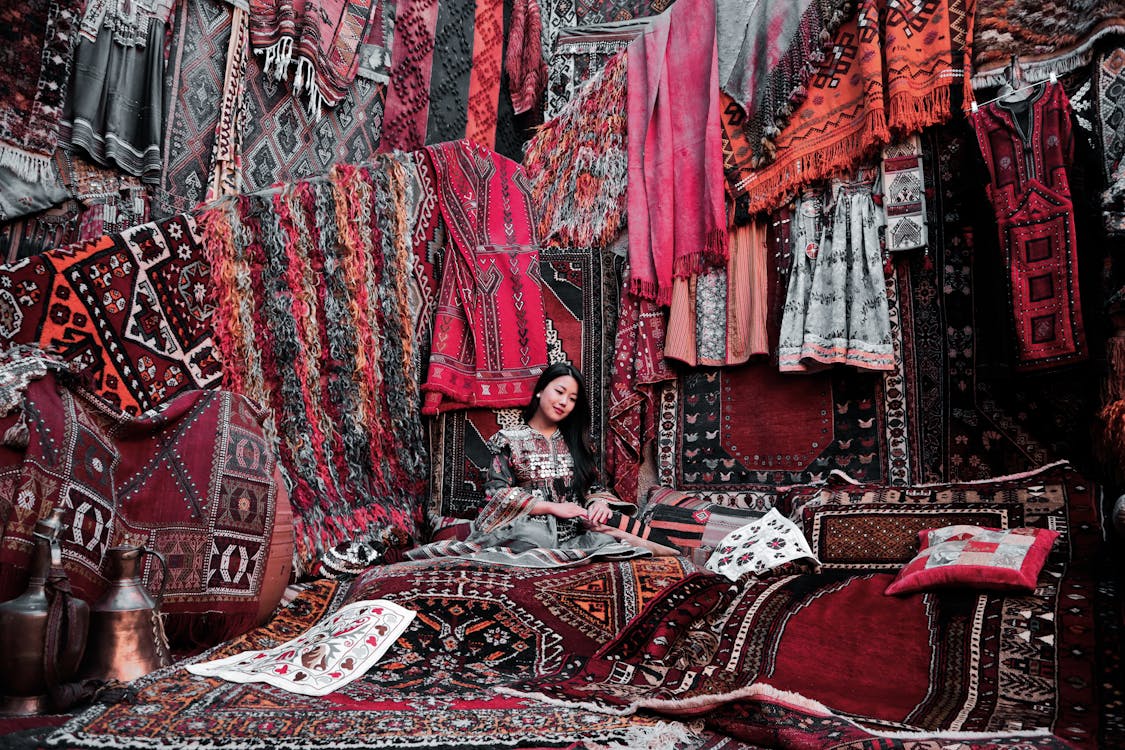 Free Woman Sitting on a Carpet Stock Photo