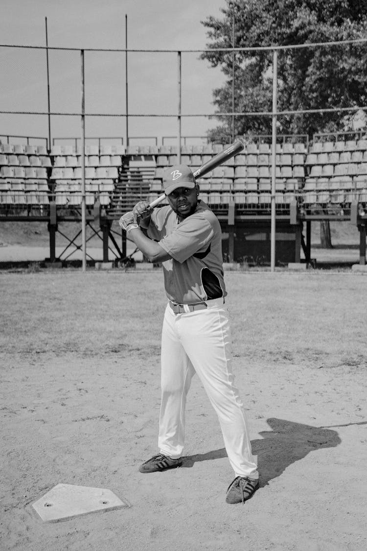 Black And White Photo Of A Man Playing Baseball