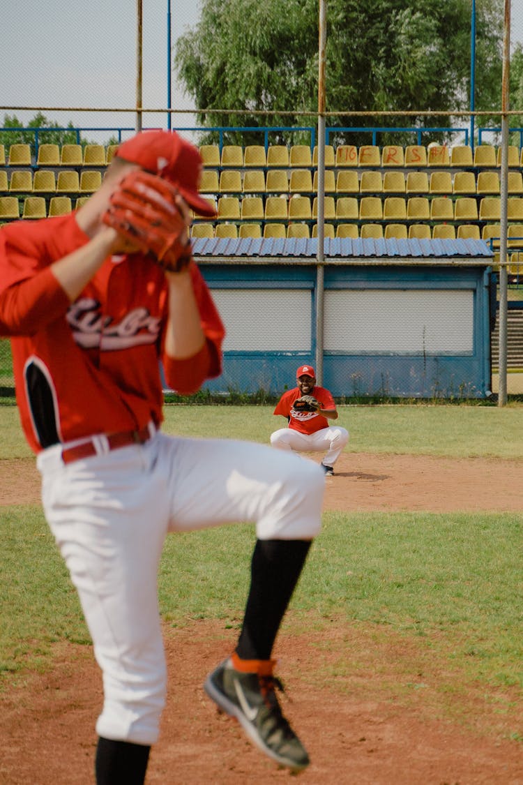 Man Pitching A Baseball