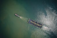 Modern ship with cargo floating in sea