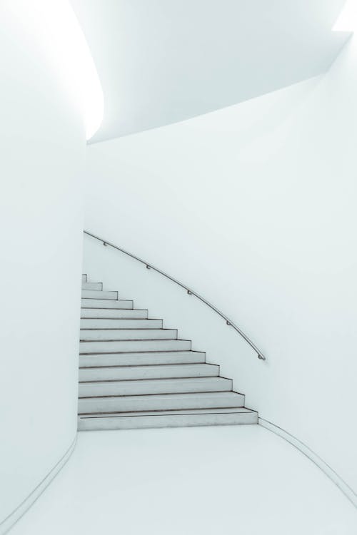 Free Staircase with railing in modern white building Stock Photo