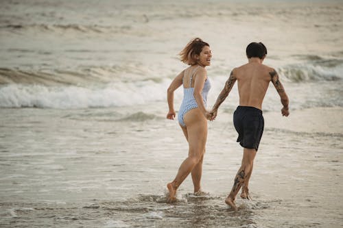 Couple Running on the Beach