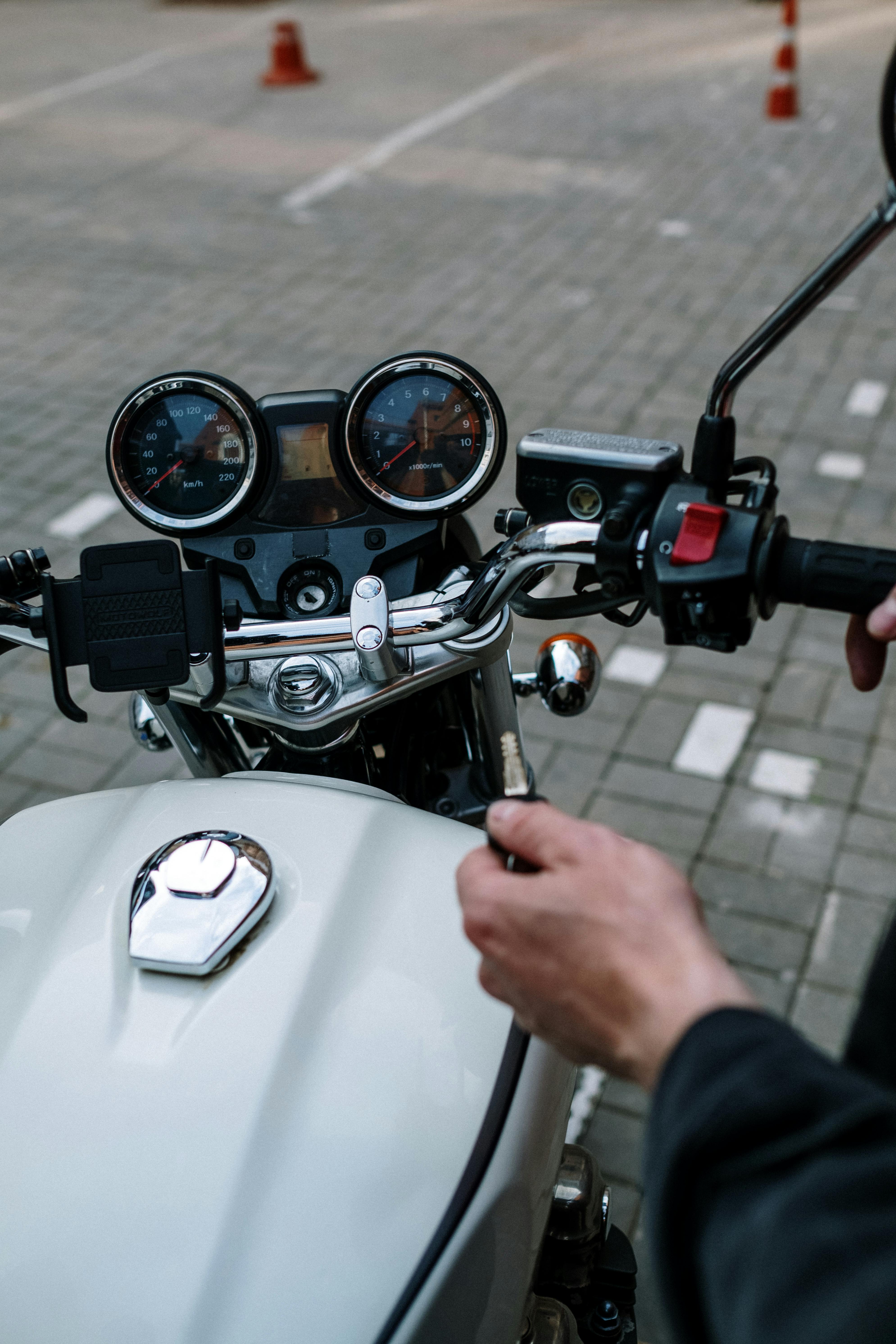 motorcycle couple holding hands