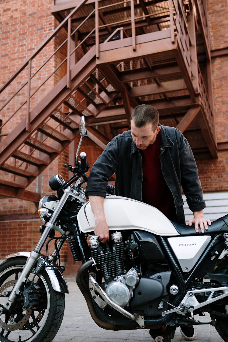 Mechanic Fixing A Motorbike