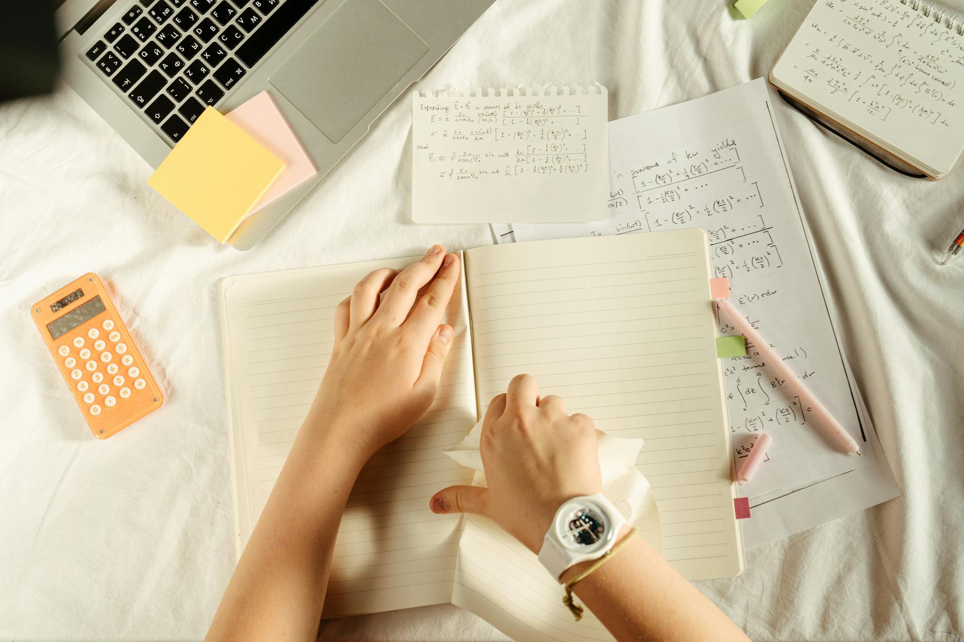 https://www.pexels.com/photo/person-tearing-a-page-from-notebook-5184950/