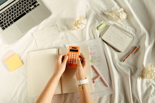 Free Person Holding Orange and White Iphone Case Stock Photo