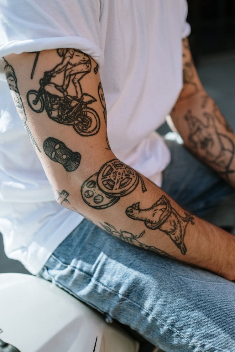 Tattoos On Person's Arm