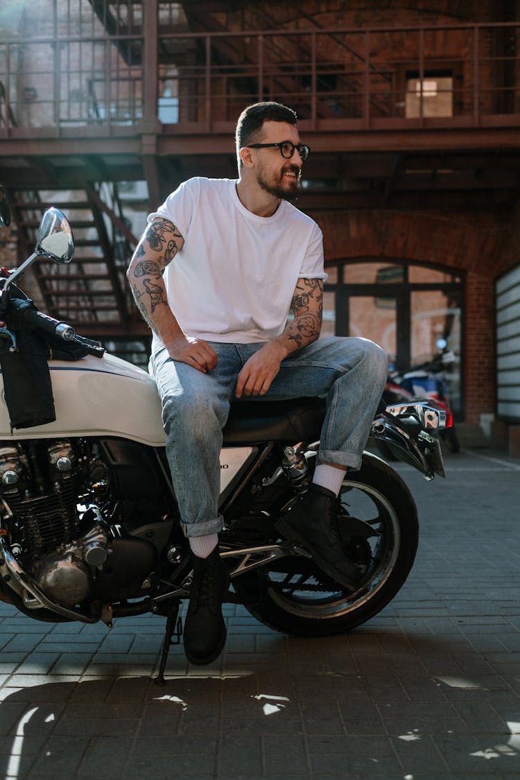 Man Sitting On A Motorcycle