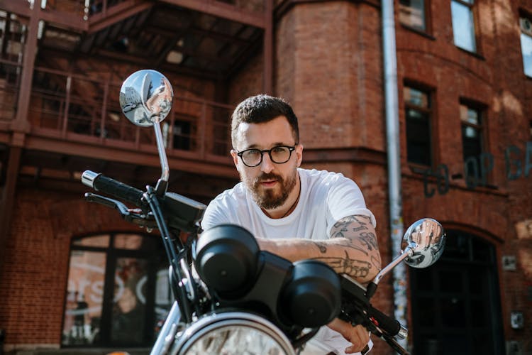 Bearded Man Sitting On Motorcycle