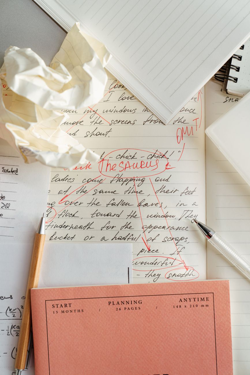 notebook page with annotated diagrams and pen sketches