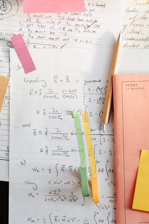 Free Math Solutions on a White Paper Stock Photo