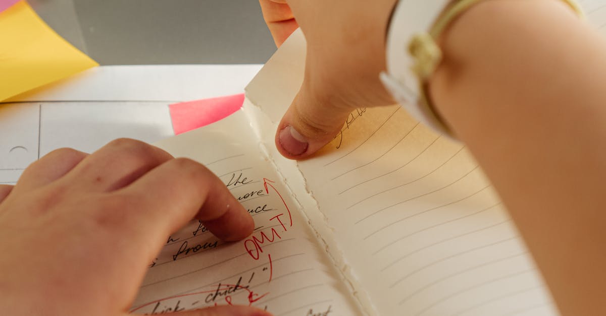 Person Tearing of a Page in a Notebook · Free Stock Photo