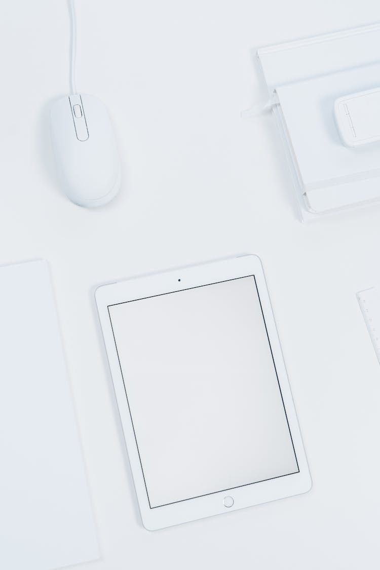 White Tablet And Mouse On A Table