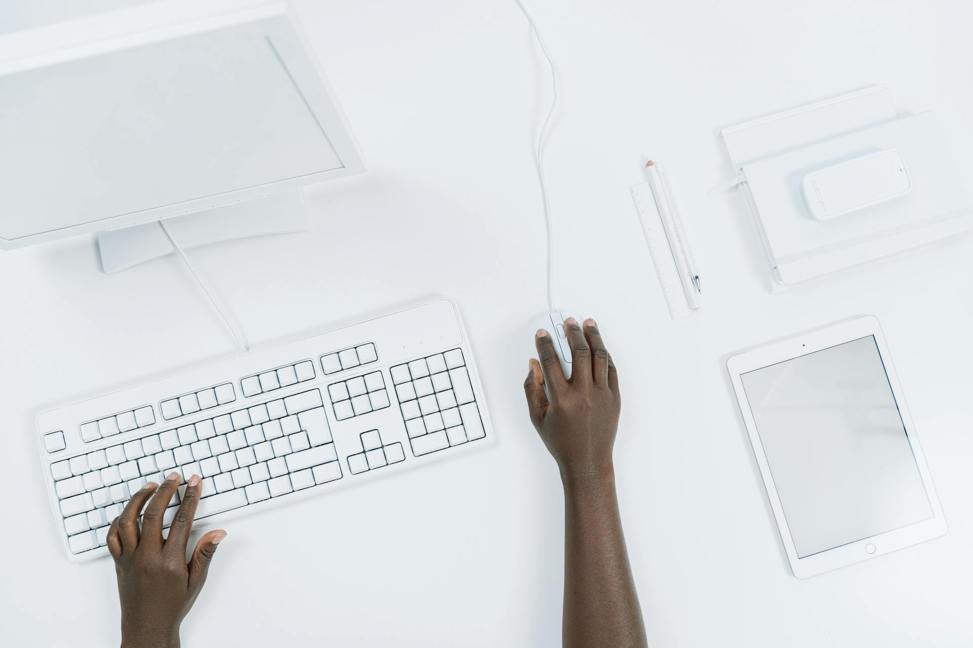 Person Using a White Computer Set