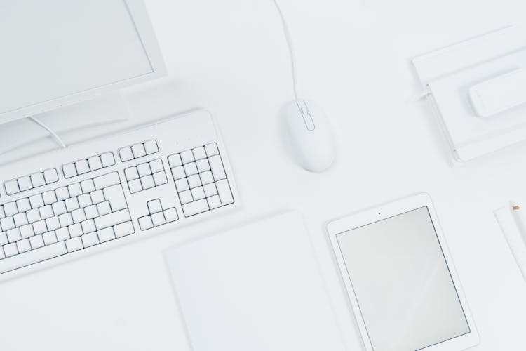 White Tablet And Computer Set Of A Desk