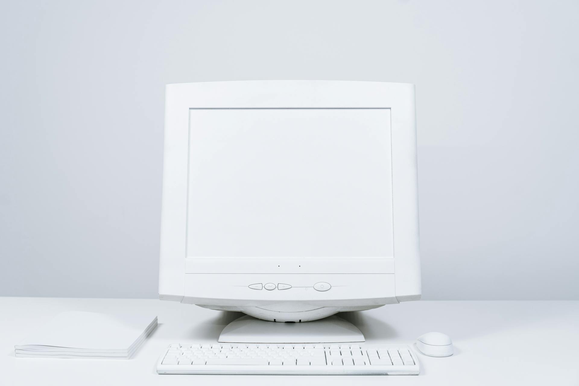 White Computer and Blank Screen Monitor