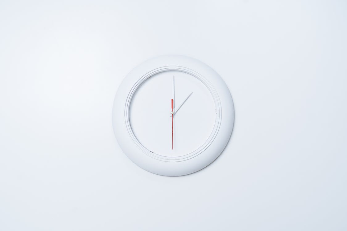 White Clock on White Wall