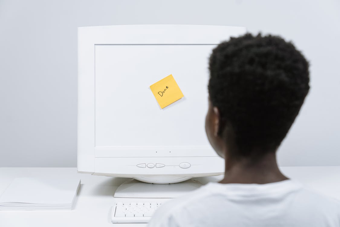 Free Done Sticky Note on a Computer Monitor Stock Photo