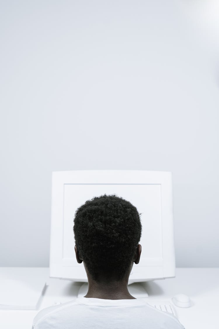 Person With Afro Hair Using A Computer