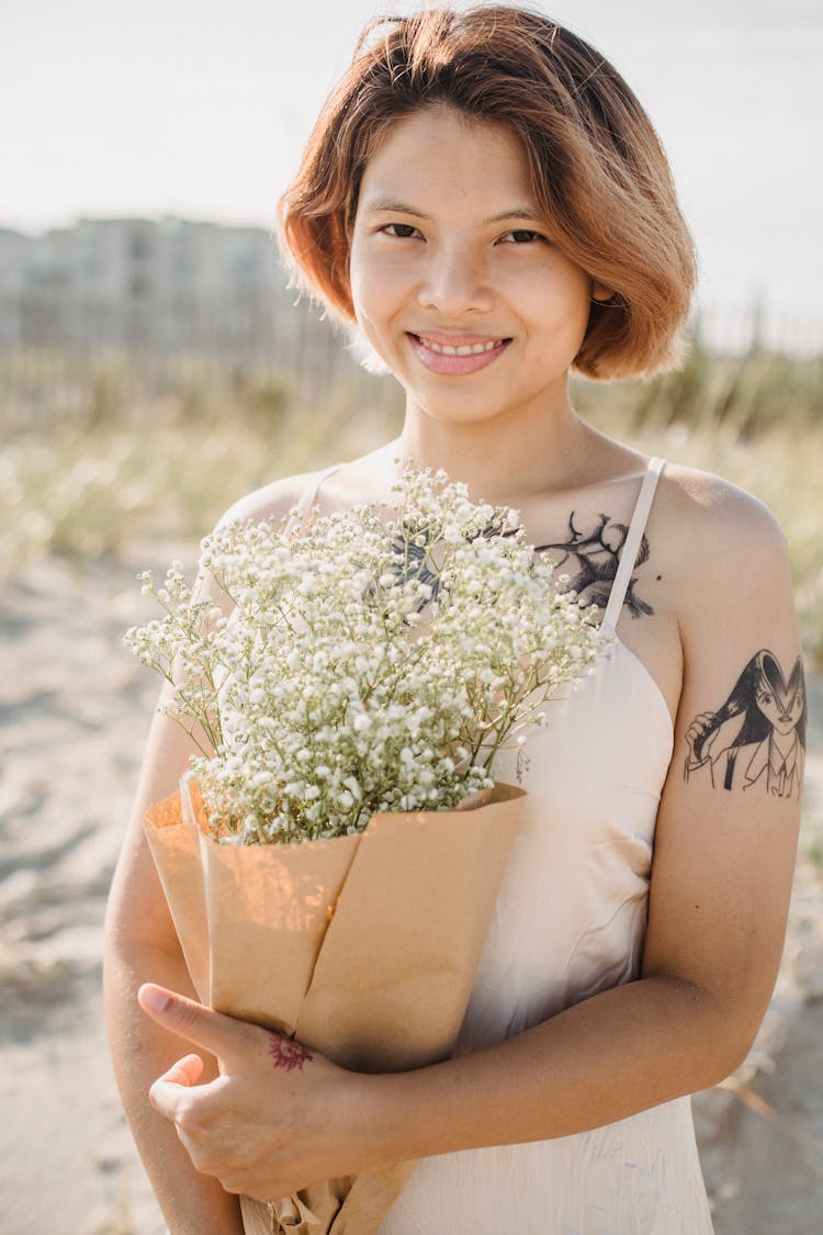 Woman Holding Bunch Of Flowers 