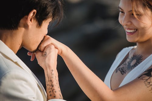 Man Kissing Woman Hand