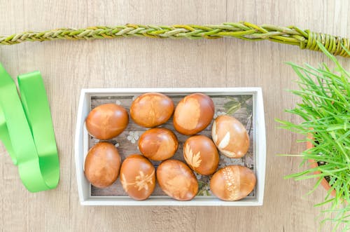 Egg on Top of White Wooden Basket