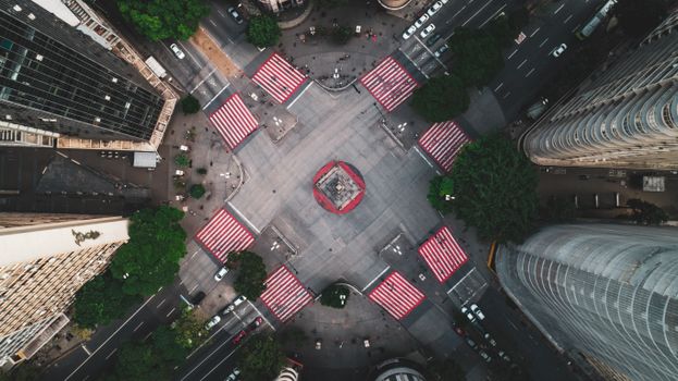 Dramatic aerial view of vibrant intersection in Brazil's bustling cityscape.
