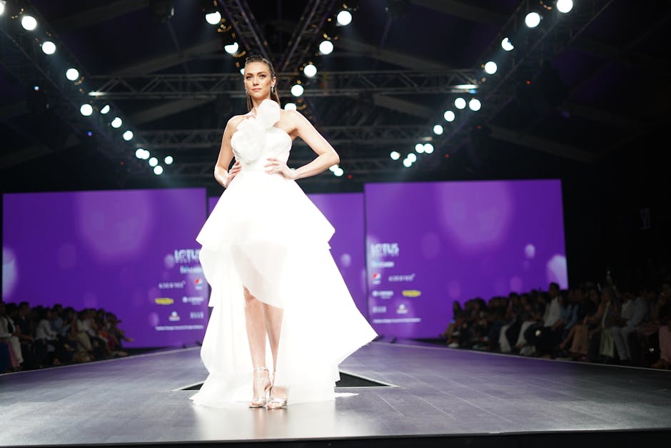 A Model in a White Dress on a Catwalk
