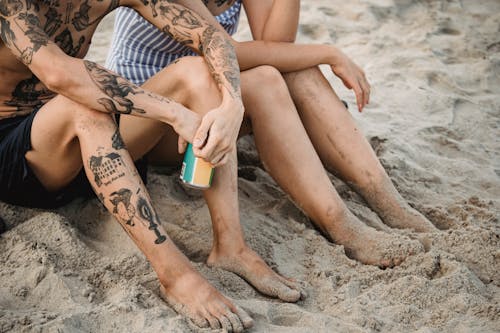 Free Legs of People on Sand Stock Photo