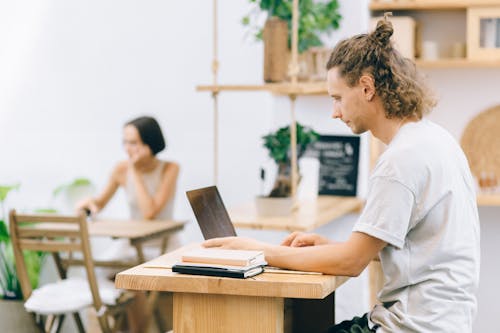 Man Browsing on Laptop